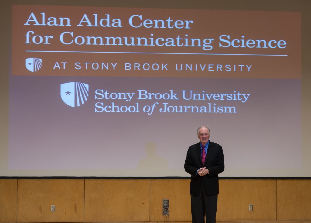 Alan with Alda Center logo