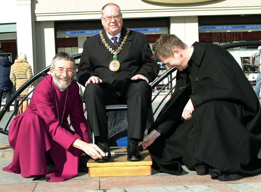  Lord Provost Bob Duncan having his shoes polished by the Bishop Of Brechin Nigel Peyton, left, and Jeremy Auld - Provost of St. Pauls Cathedral in 2013