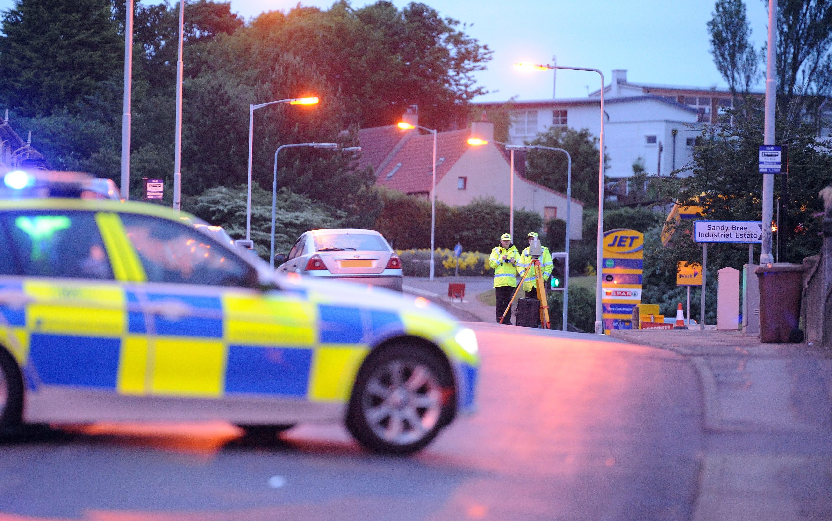 Police investigators at the scene of Thursday night's accident in Kennoway.