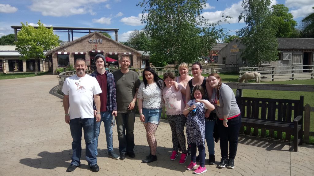 Mr Mackenzie pictured with his family at Flamingo Land in Yorkshire in the week before he died.