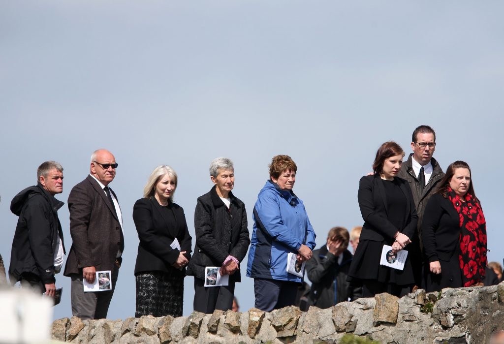 Mourners watch the funeral procession of Manchester bomb victim Eilidh MacLeod on its way to the Church of Our Lady, Star of the Sea, in Castlebay.