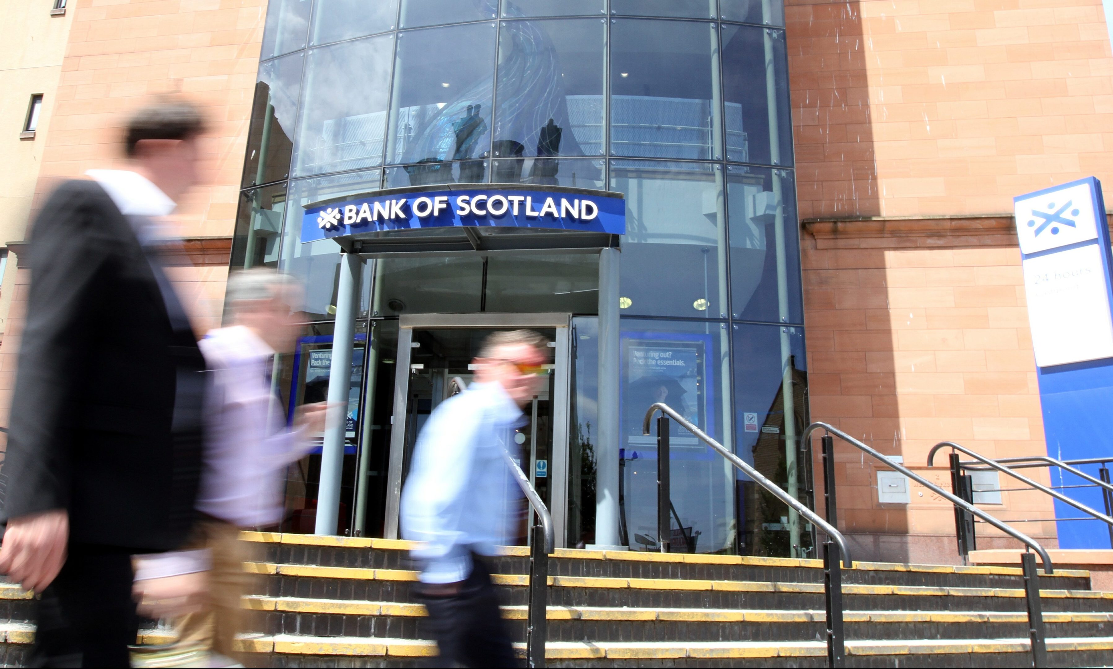 People passing by the Lloyds Bank of Scotland premises in Dundee.