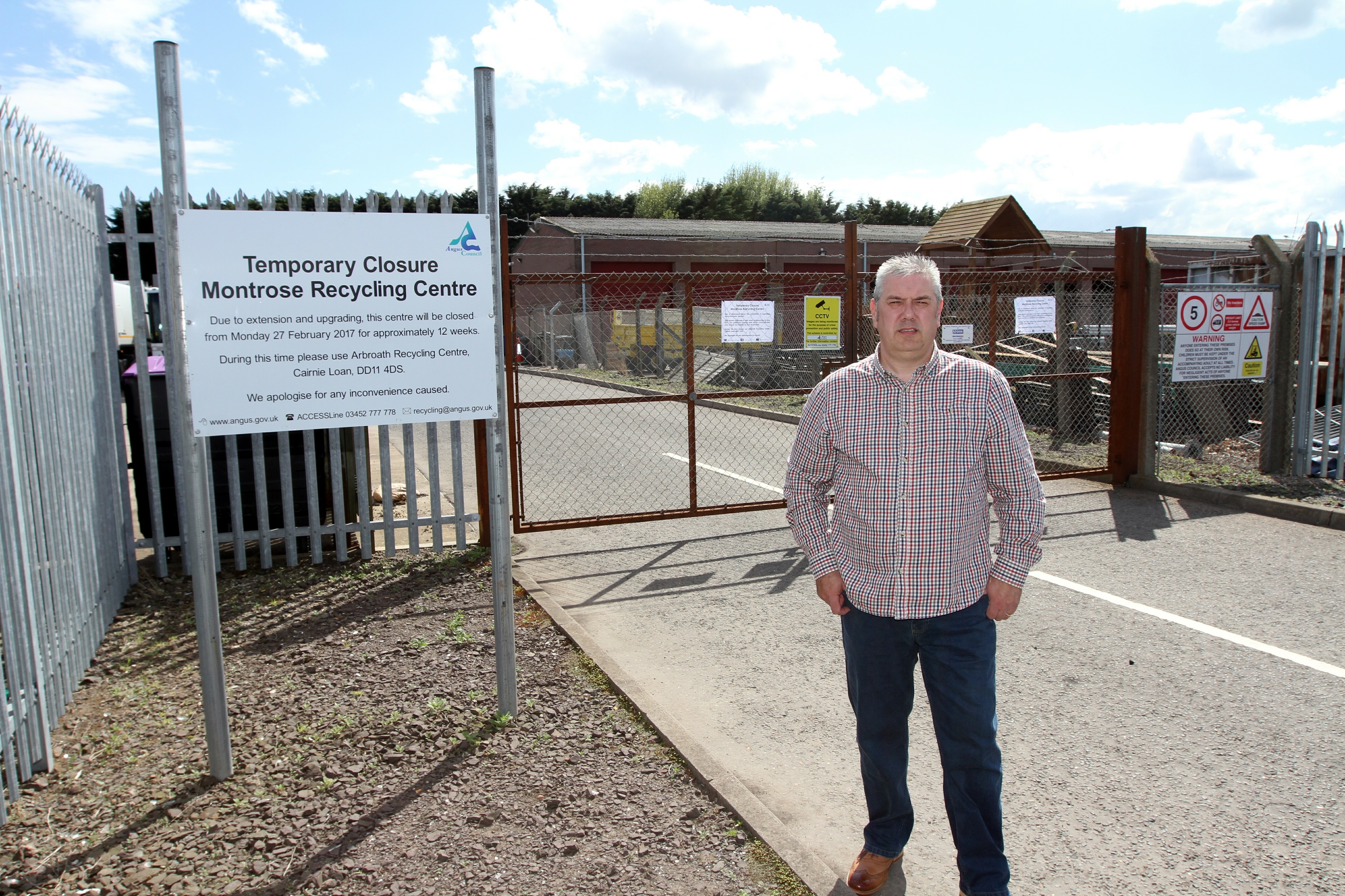 Tommy Stewart outside the locked gates of Montrose Recycling Centre.