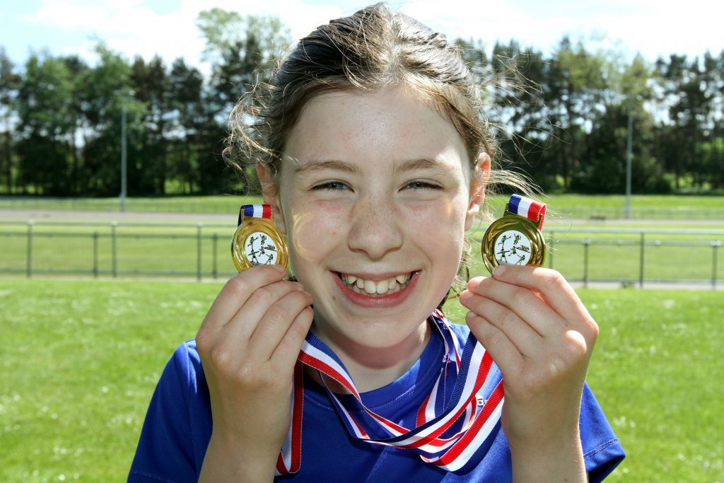 P7 girls 800m and long jump winner Grace Matthews of Eastern Primary.
