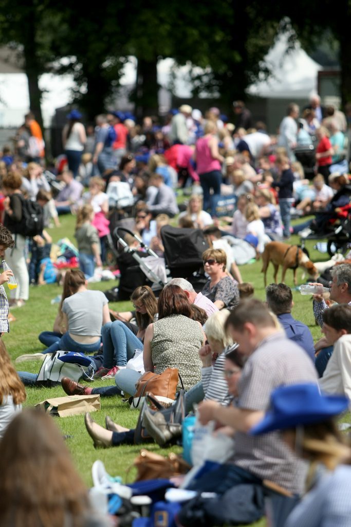 Crowds and livestock at the Royal Highland Show.