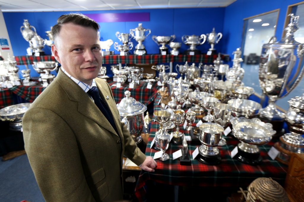 Alain Wright, Trophy Room manager with just some of the silverware available at the show.