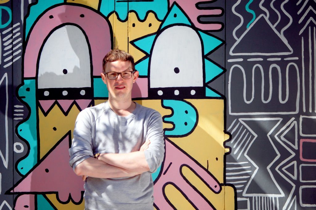 Russell Pepper, organiser of OpenClose Dundee, in front of Thing Thing's artwork.