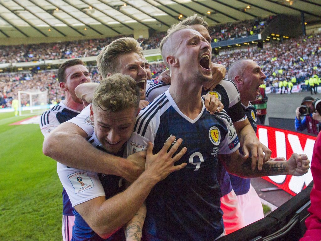 Scotland's players celebrate a Leigh Griffiths' goal.