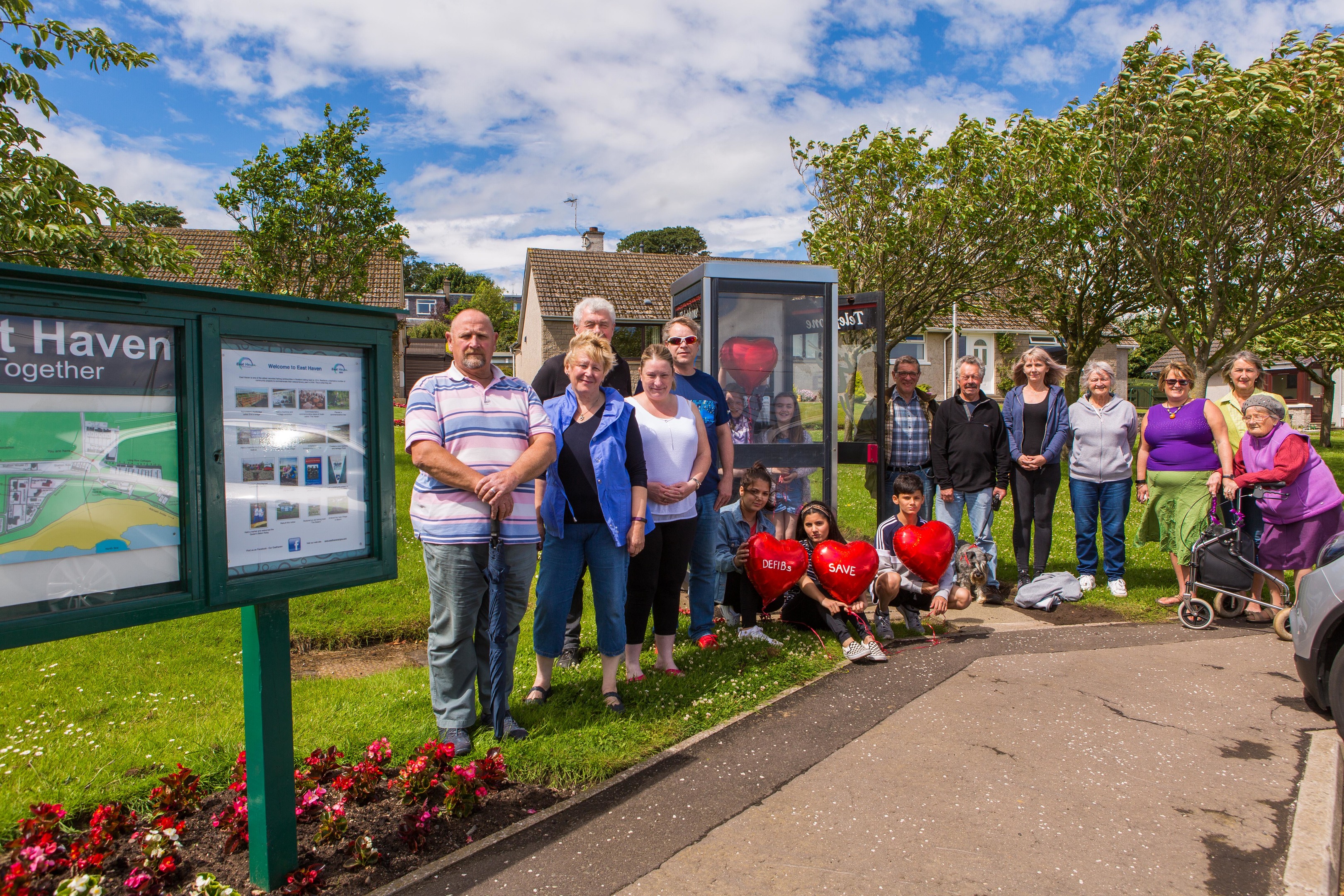 East Haven residents at the telephone box to be converted.