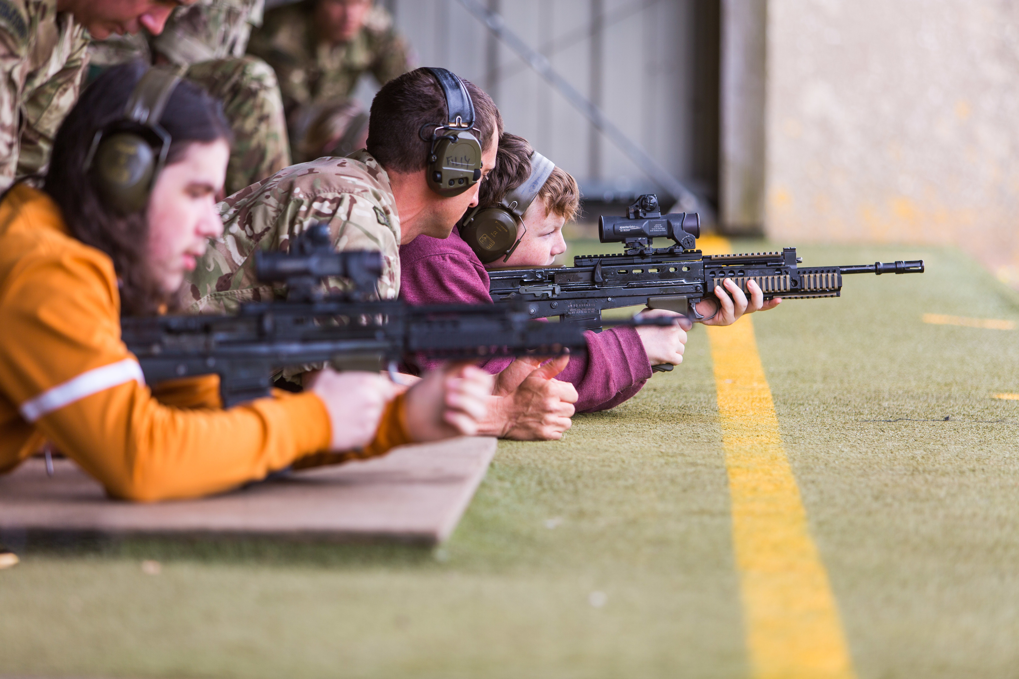 Royal Marines demonstrate to Lochlan Thomson (13) the workings of an SA80 prior to going live on the range.