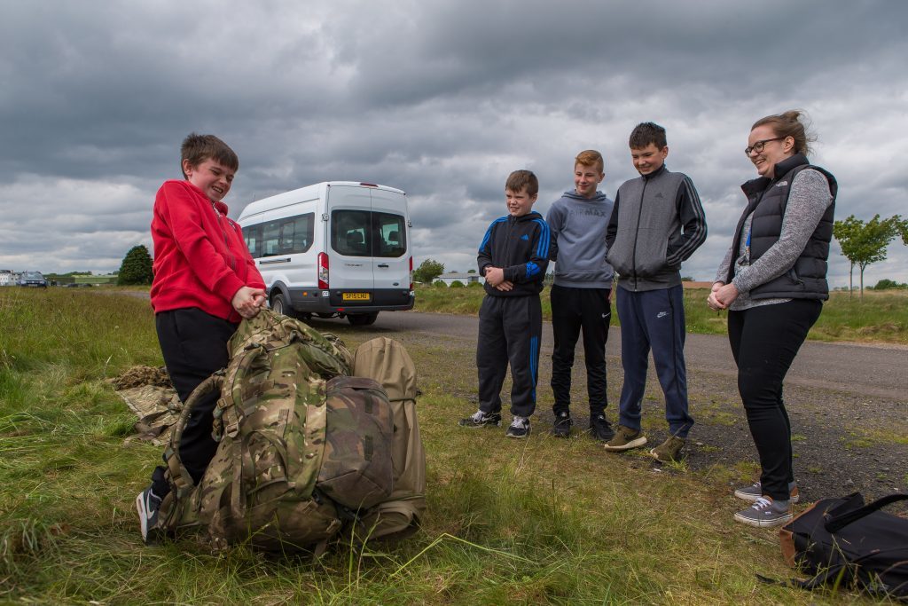 Josh Smeaton (12) of Forfar Academy attempts to lift the 50Kg soldiers pack.