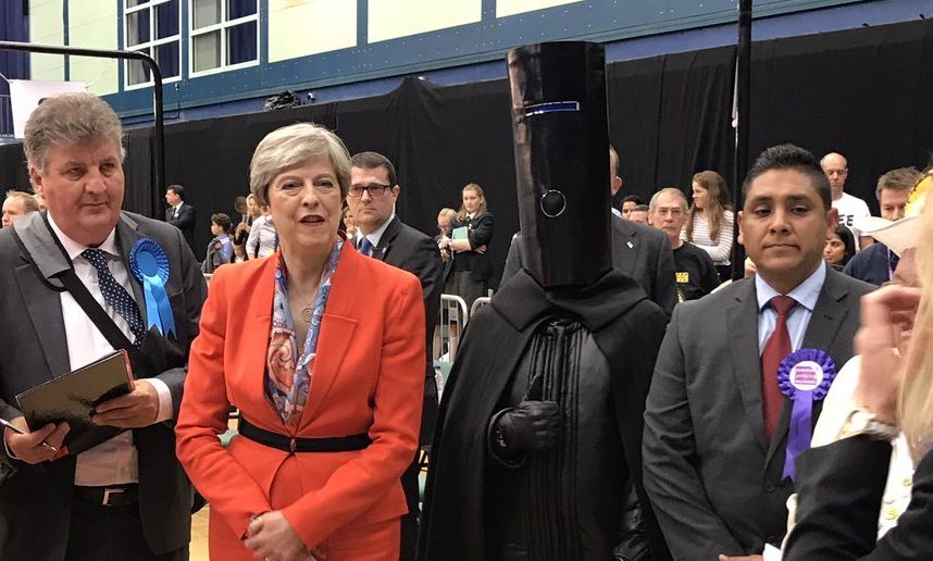 Theresa May next to Lord Buckethead. Credit: @LordBuckethead