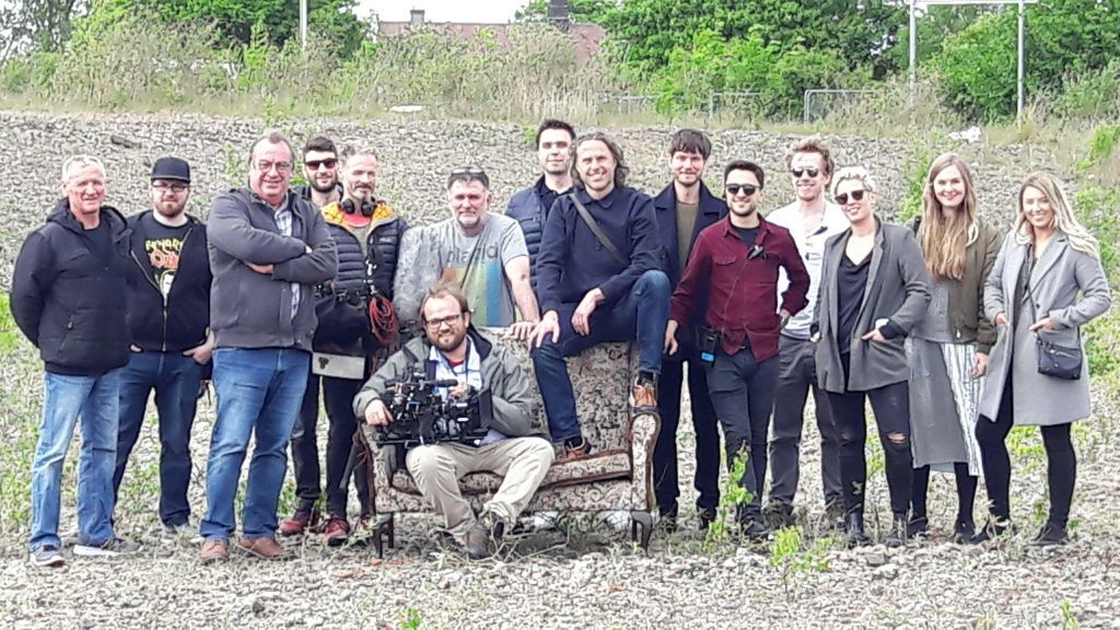 The cast and crew making the Courier advert, pictured on waste ground at Kingsway East, Dundee