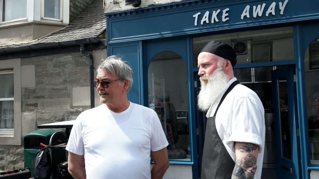 Murray's chip shop owner Angus Murray with actor Dave Dixon who is playing the 'rock n'roll friar'