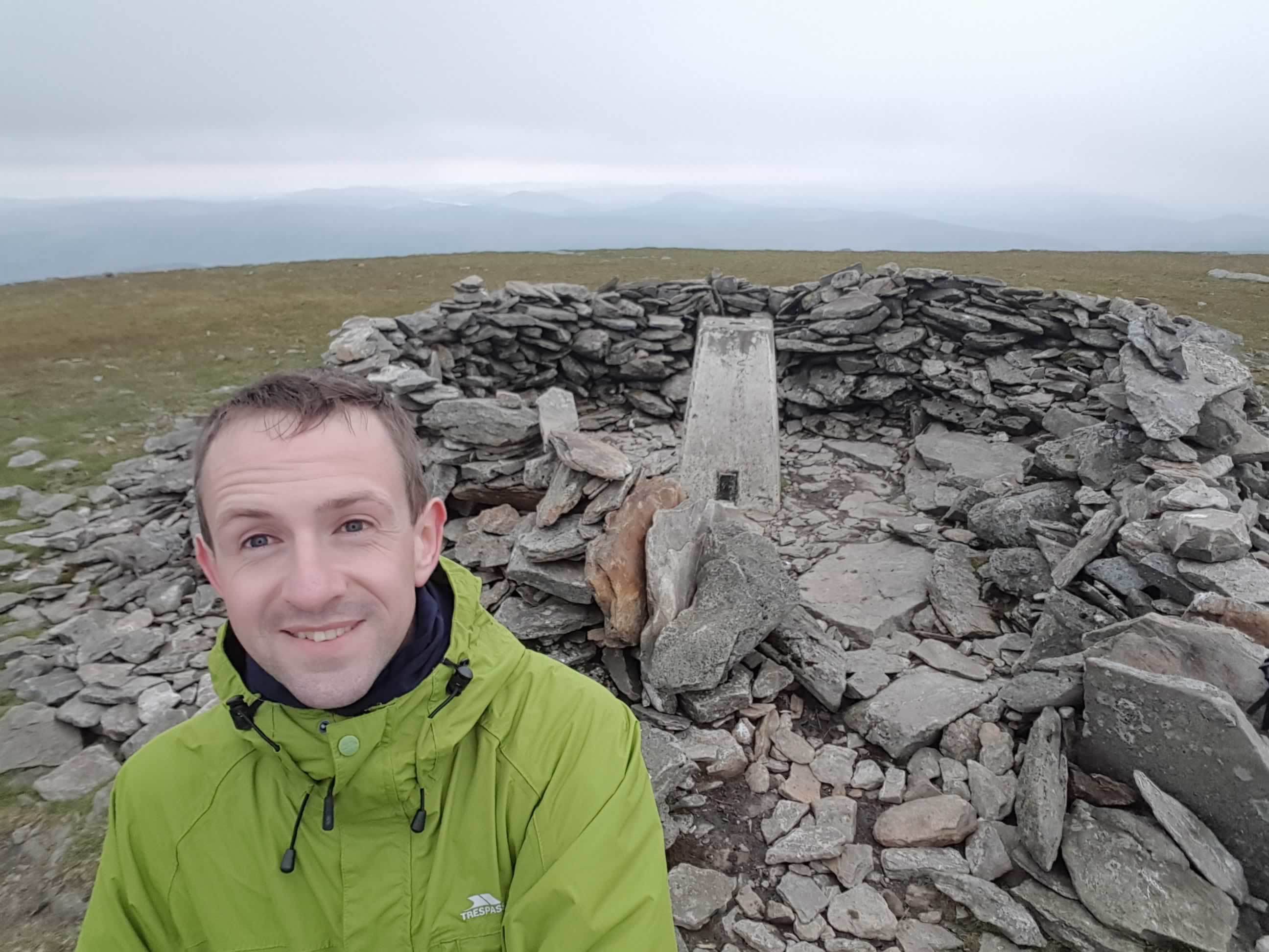 Mr Ogilvie at the top of Driesh during his munro challenge.