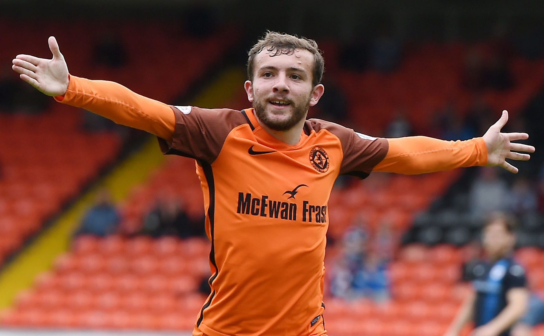 Dundee United's Paul McMullan celebrates his opener.