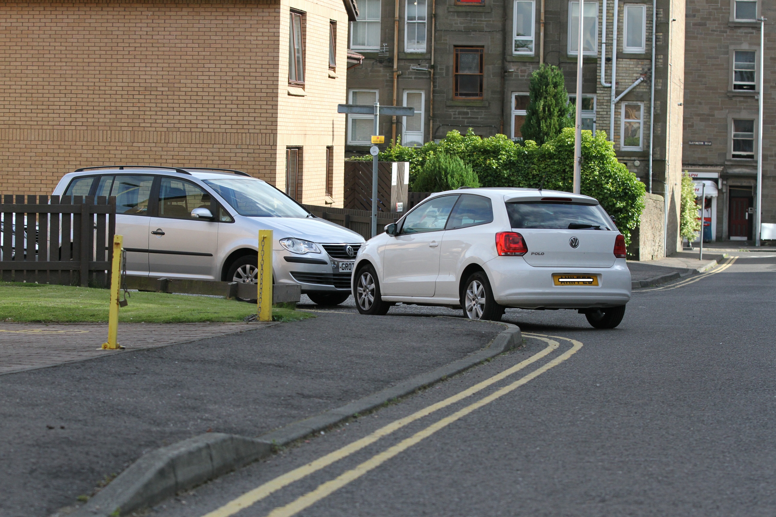 Cars parked on double yellow lines on Cardross Street.