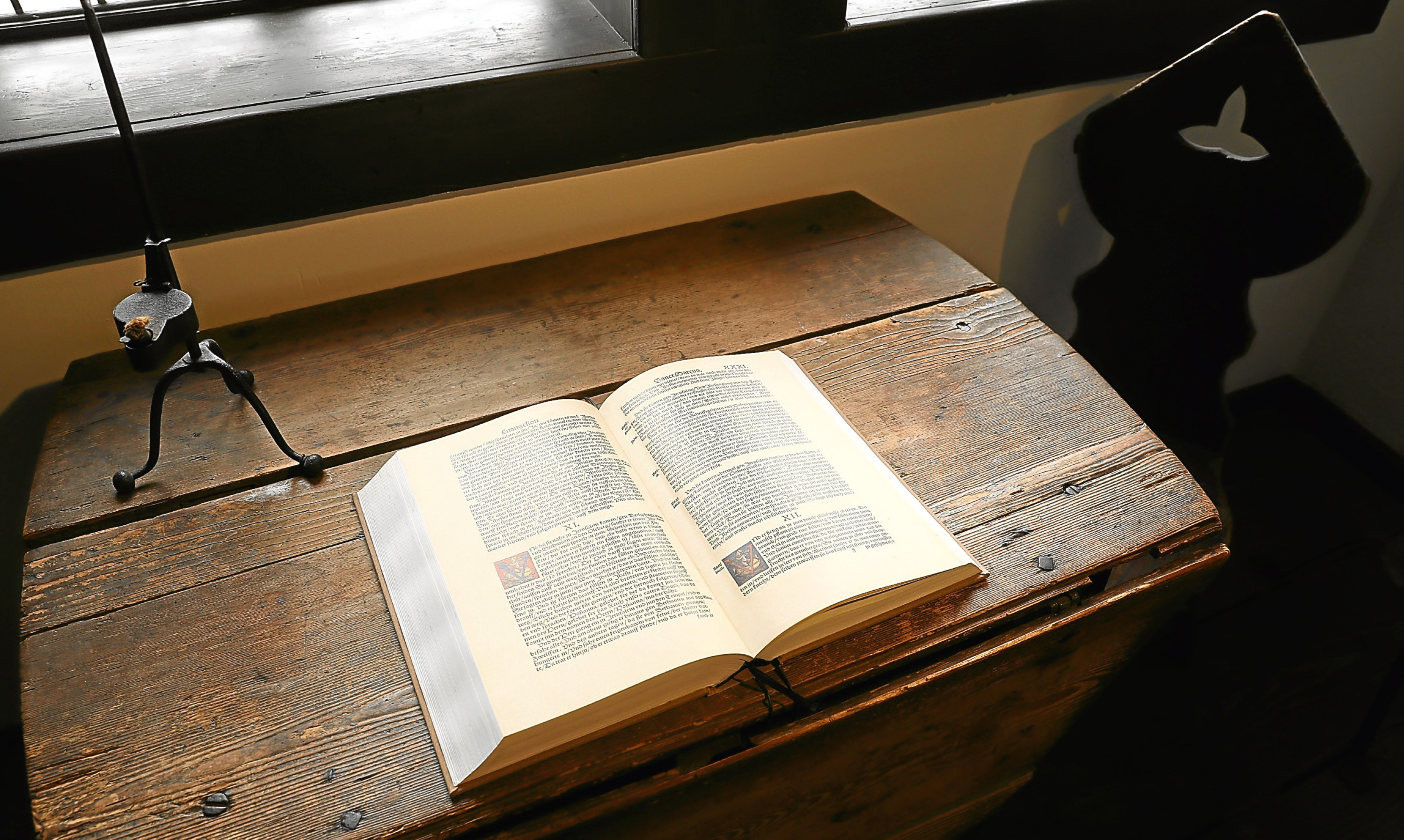 A modern reproduction of Martin Luther’s translation into German of the Bible lies on a table at the Lutherhaus Museum in Eisenach, Germany.