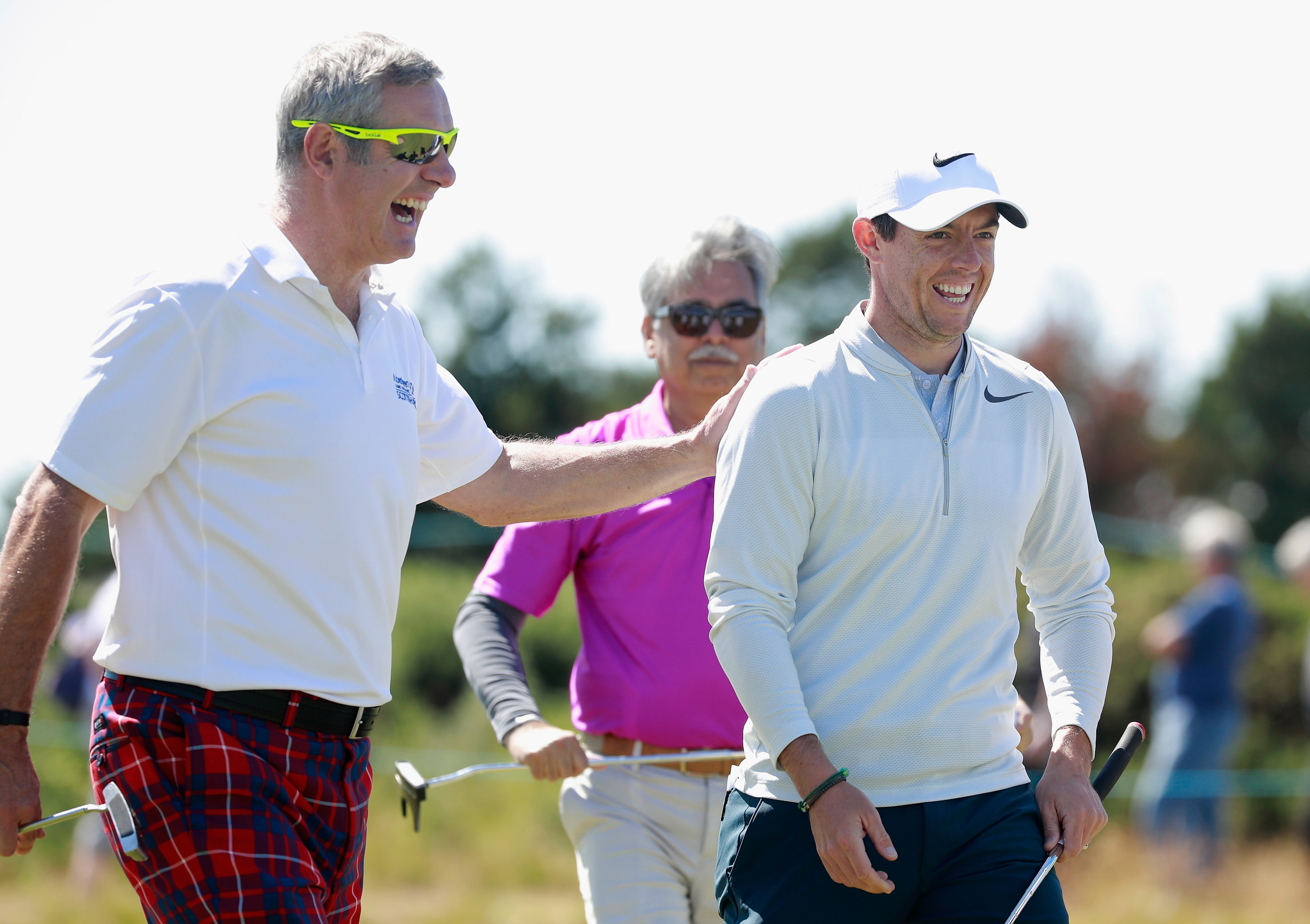 Rory McIlroy and former Sctoland and Lions caotain Gavin Hastings enjoying the Scottish Open pro-am at Dundonald Links.