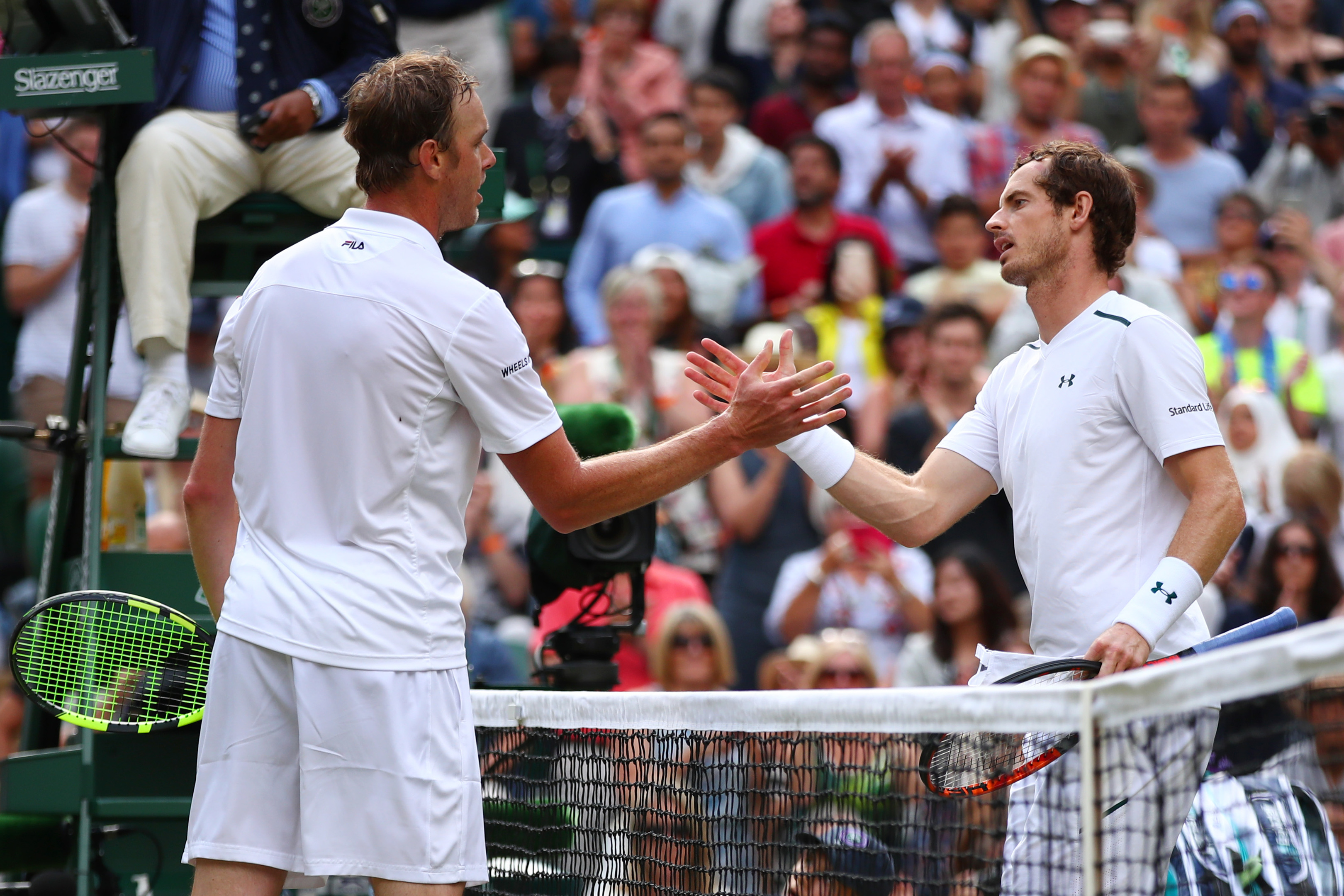 Andy Murray of Great Britain and Sam Querrey of The United States shake hands after the Gentlemen's Singles quarter final match on day nine of  Wimbledon.