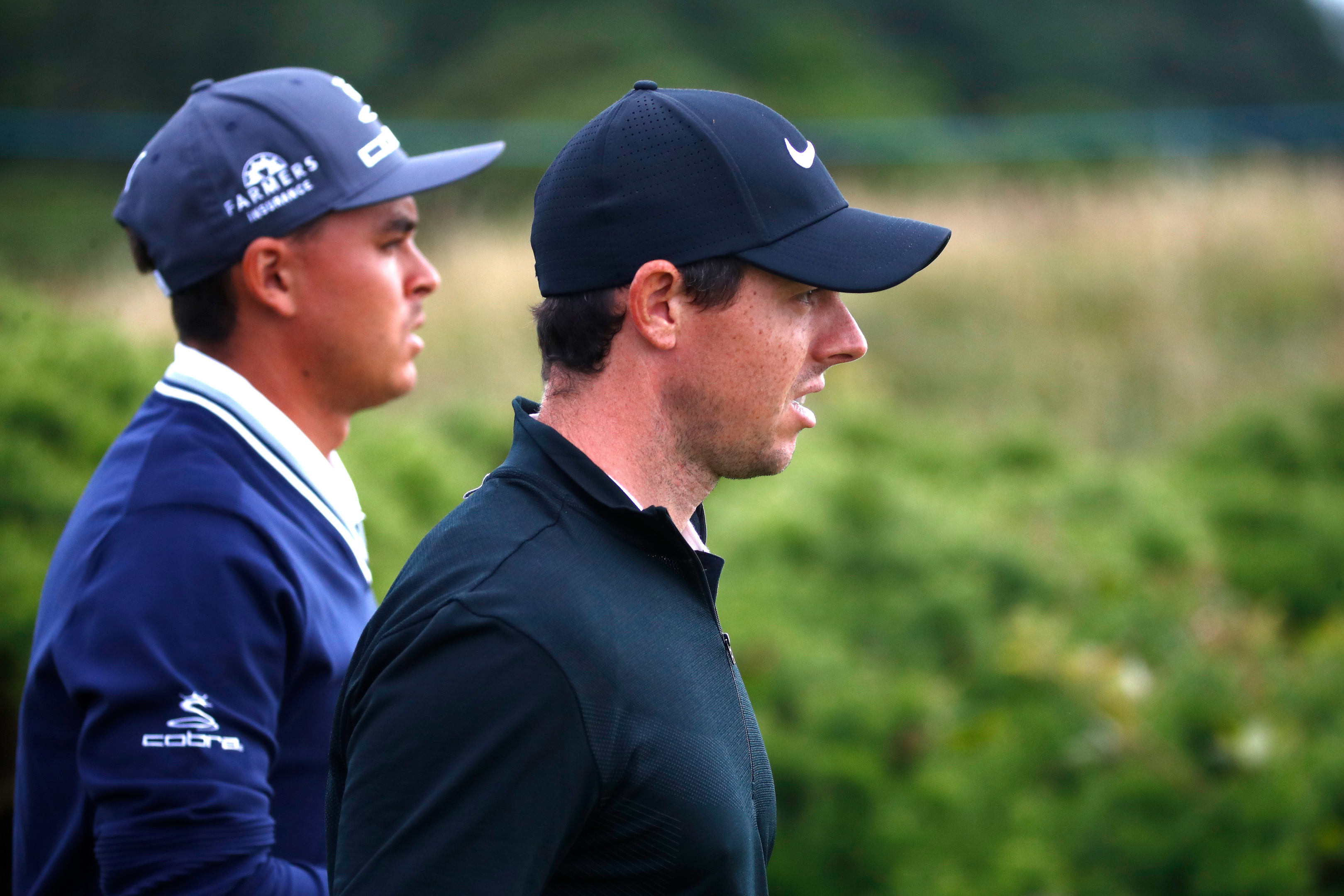 Rickie Fowler (left) prospered as Rory McIlroy struggled on the opening day of the AAM Scottish Open.