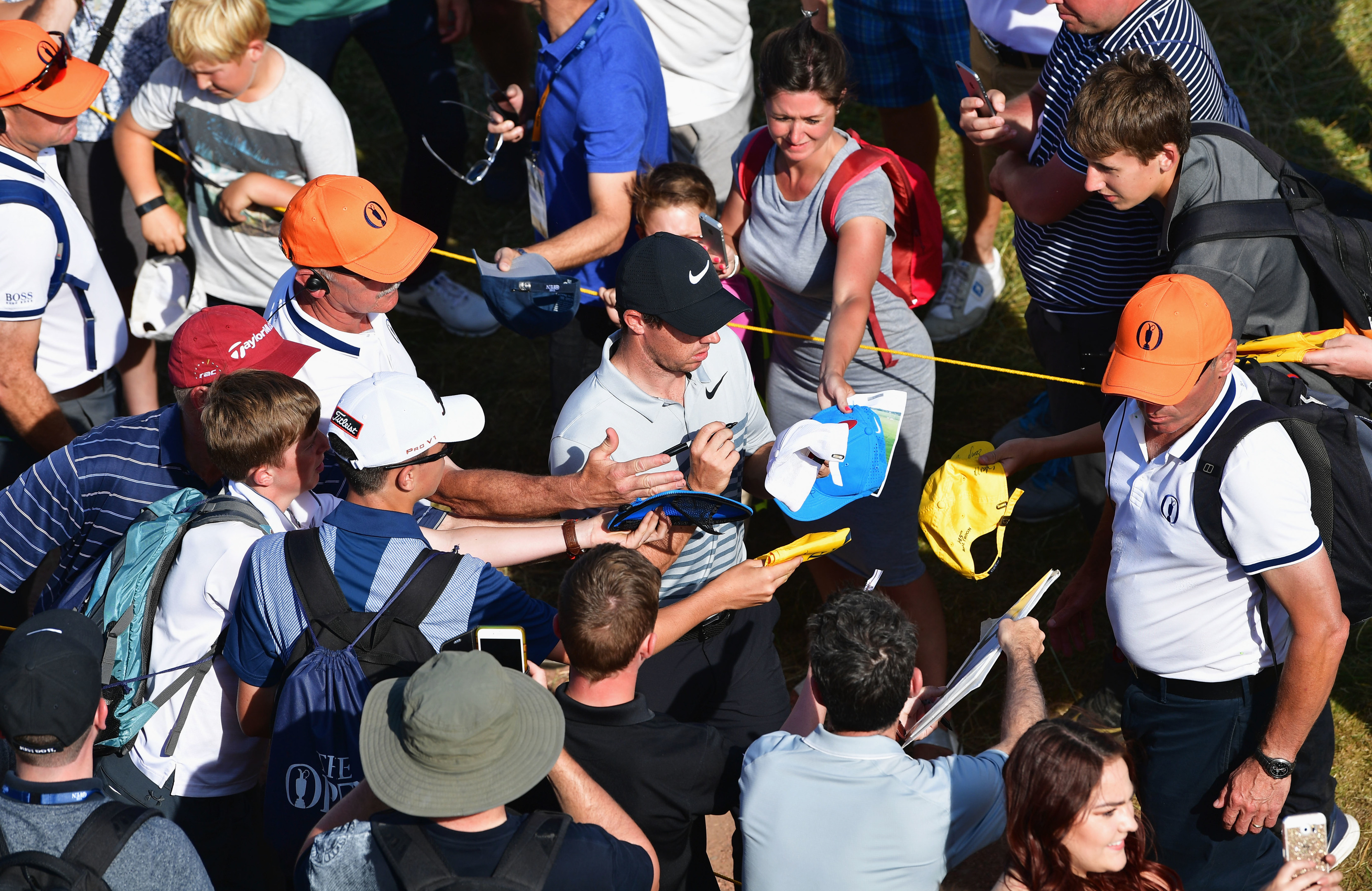 Scrambling for form he may be, but Rory McIlroy is still a huge draw for the autograph hunters.