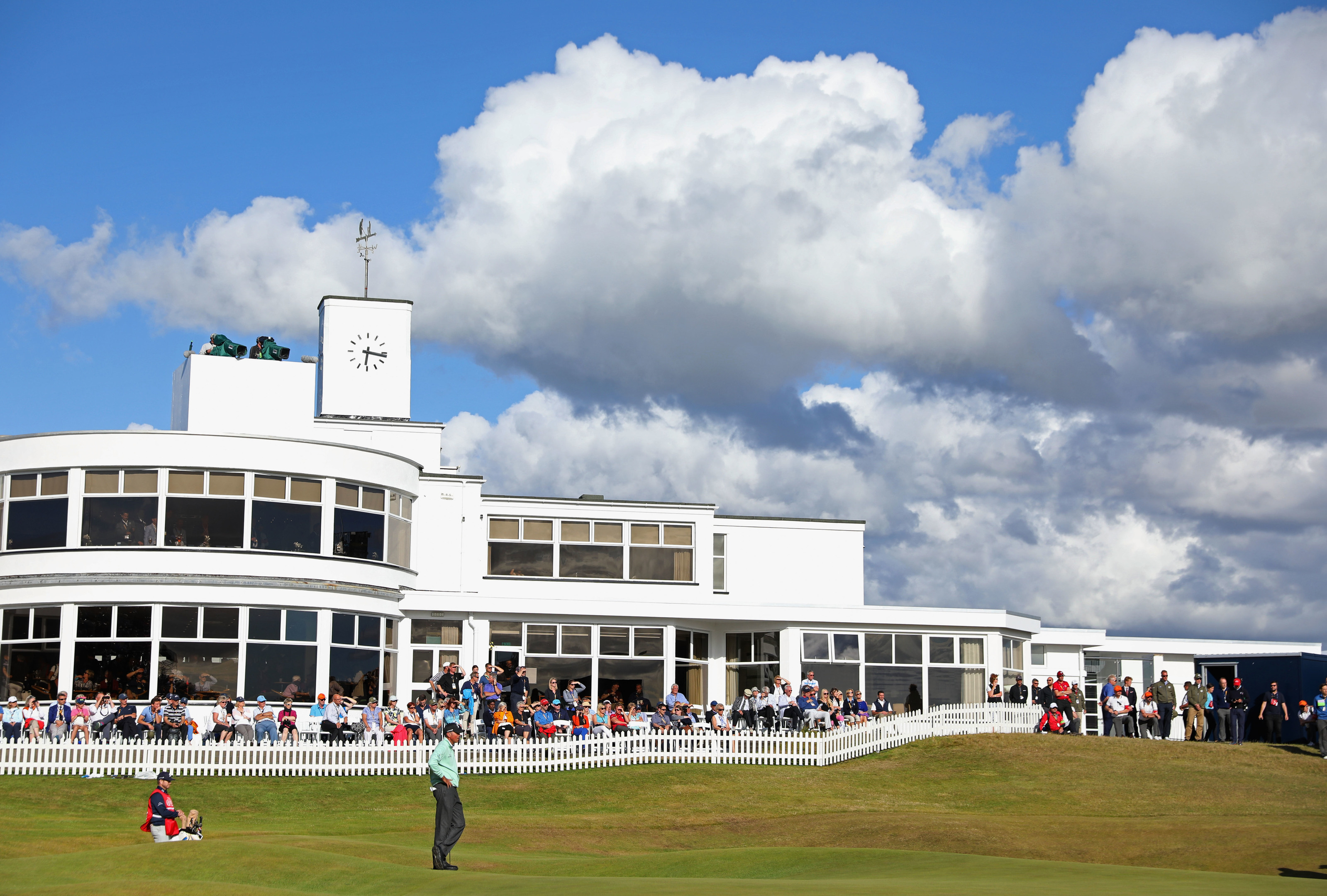 Matt Kuchar gets up and down at the back of the 18th to complete his co-leading 65 at Birkdale.