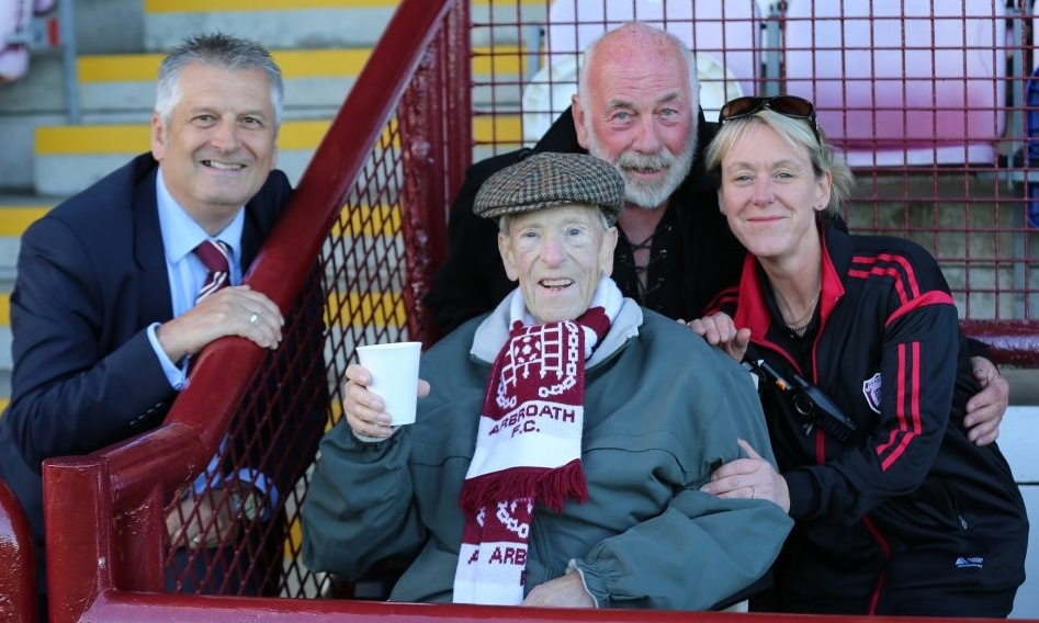 Angus is pictured at his last game at Gayfield in fantastic spirits at the match against Bolton Wanderers with Arbroath chairman Mike Caird, friend Dave Ramsay and facilities and kit manager Louise Walker.