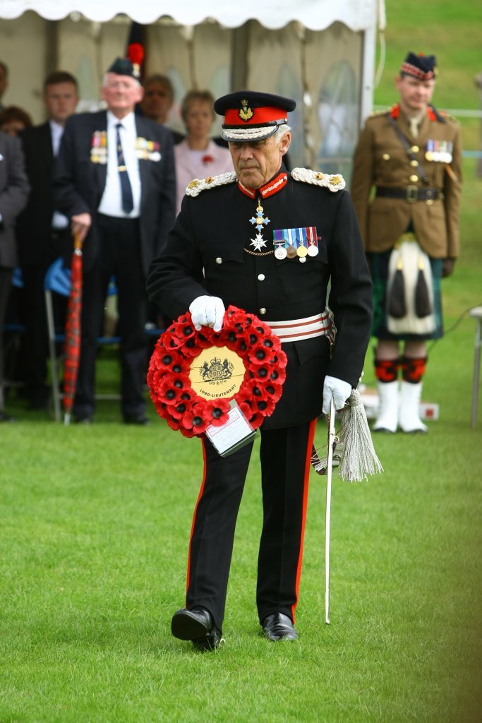 Brigadier Mel Jamieson goes to lay his wreath at the parade and Drumhead Service.