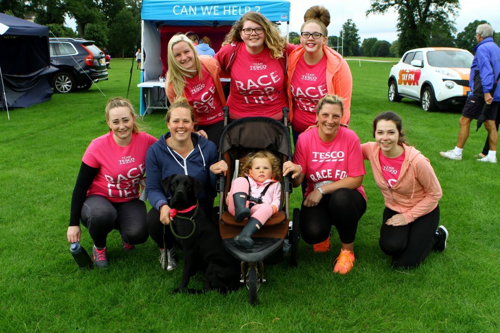 The team from Tesco, Crieff Road in Perth, with Poppy Wilson in the pram, and Josie the dog, at the Race For Life, at the North Inch in Perth.