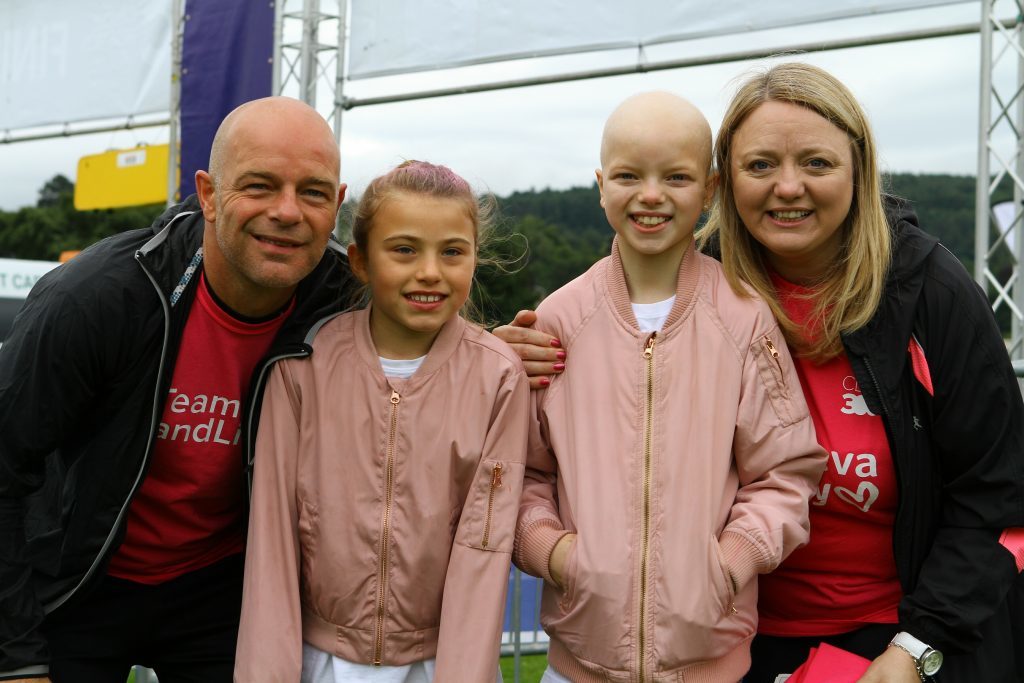 Nine year old Lily Douglas, 2nd right, with her parents Scott Robertson and Jane Douglas, and Lily's best friend Cerys Robertson at the Race For Life.