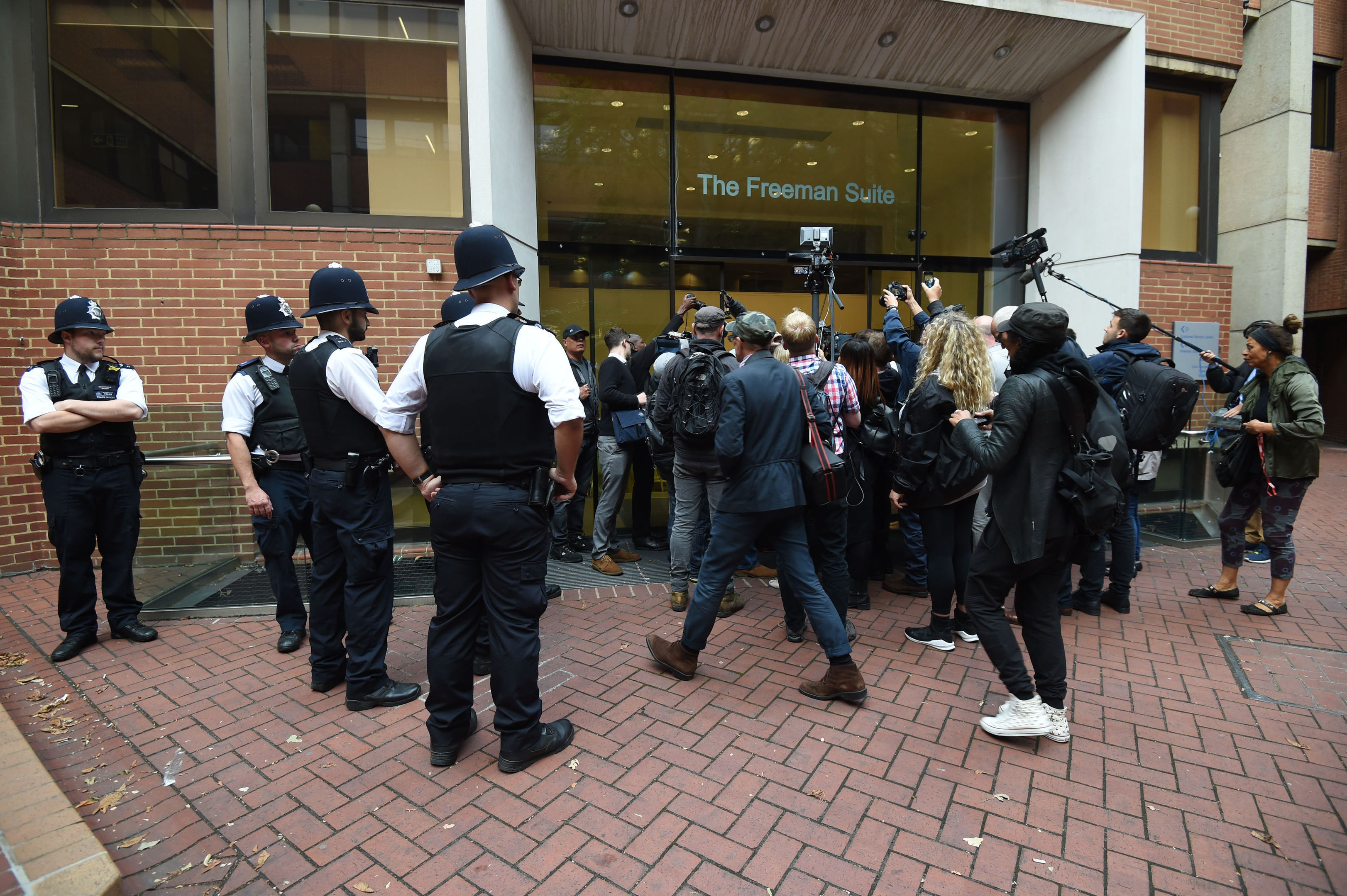 People gathered outside Kensington Town Hall after an 11th-hour decision to shelve Kensington and Chelsea Council's first cabinet meeting since the Grenfell Tower disaster was branded an "absolute fiasco".