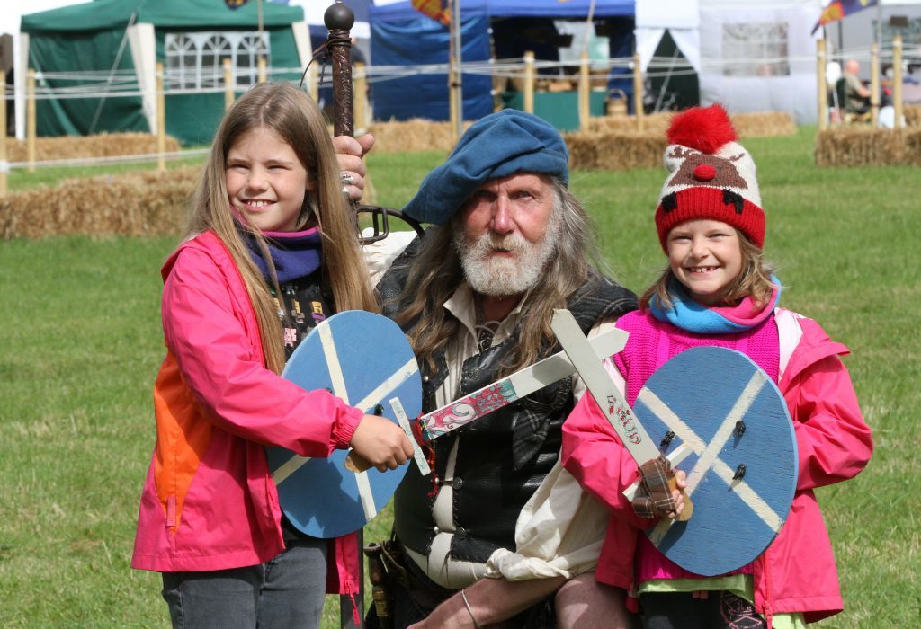 Maia (9) and Ayden (8) Massie from Pitlochry with Jacobite John Neilson.