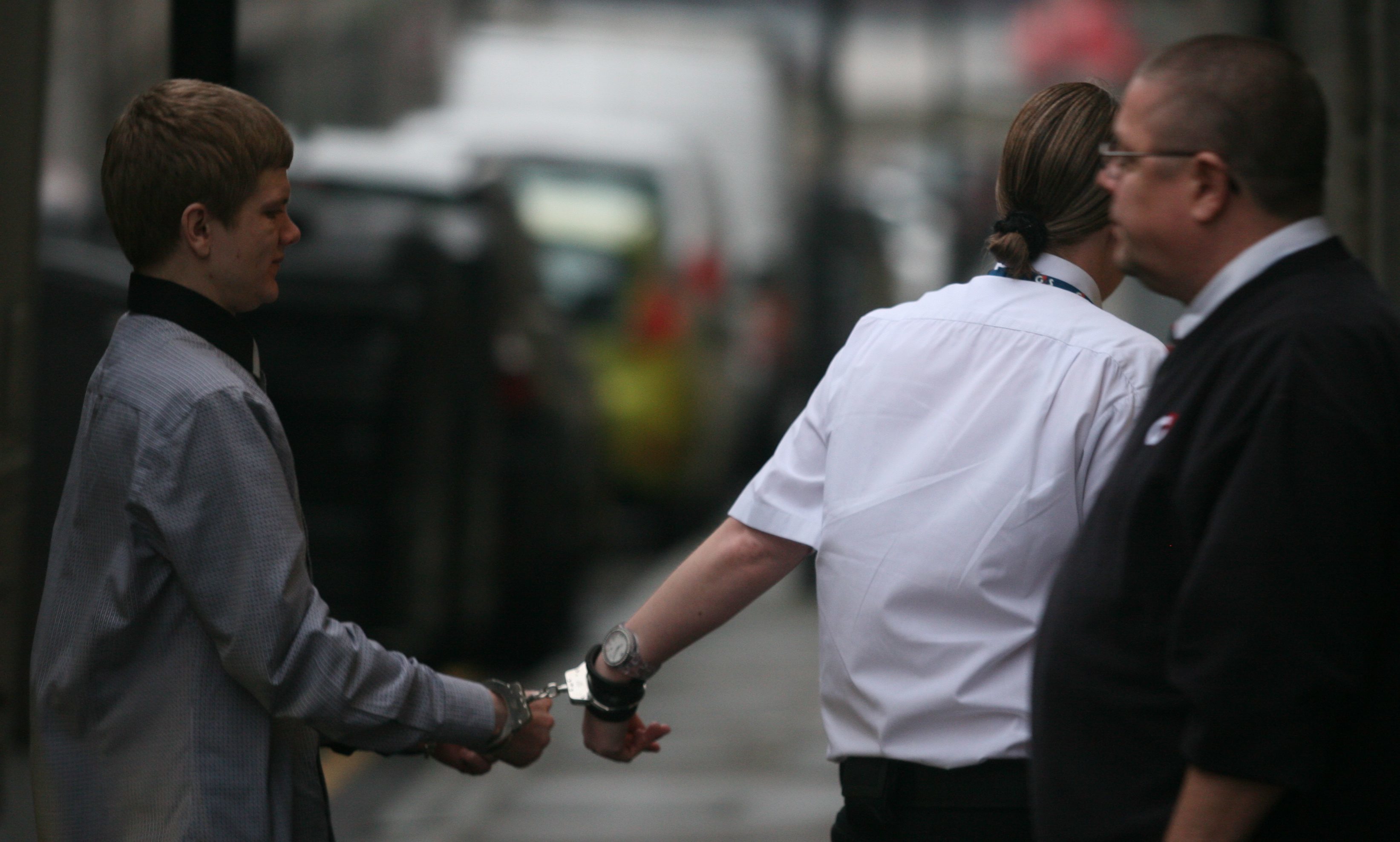 Matthew Pope being led away in handcuffs after his trial in 2014.