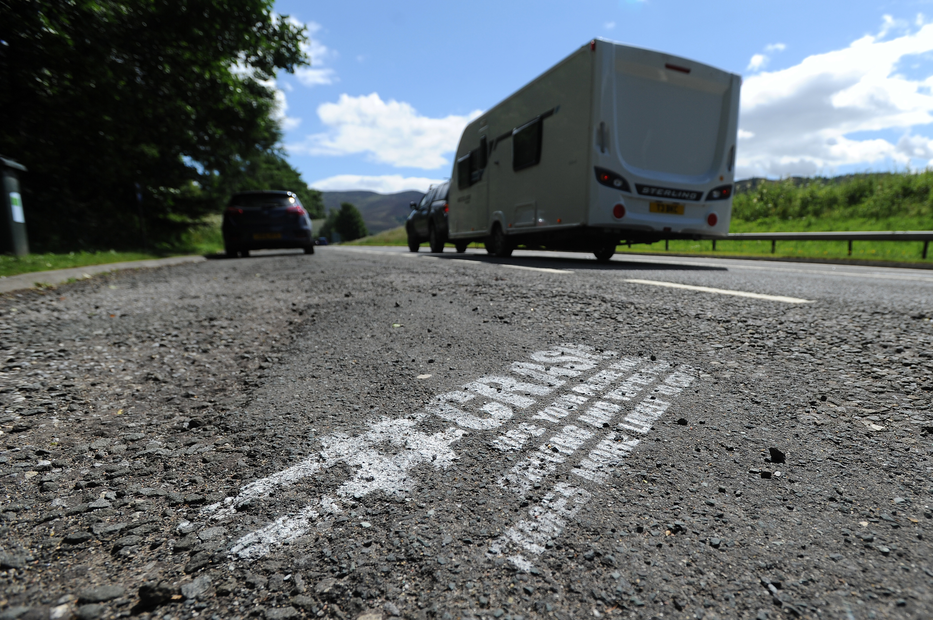 Road safety messages have been sprayed onto lay-bys on the A9.