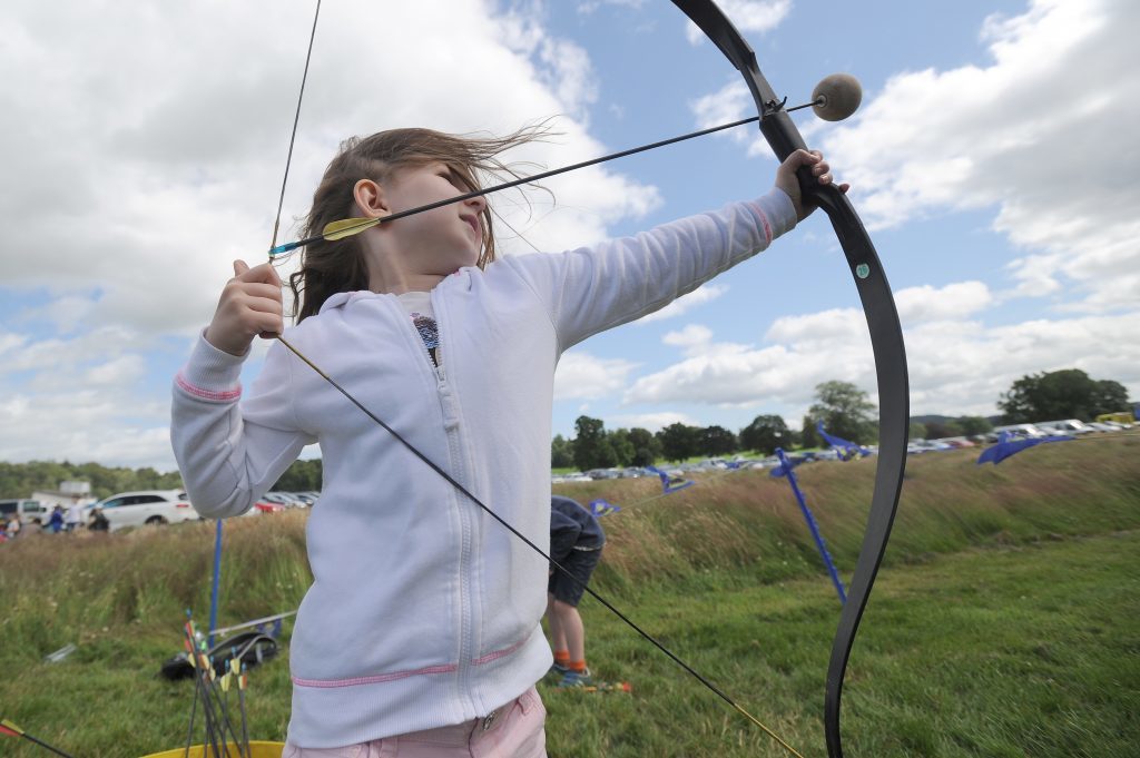 Action from the Flu Flu Archery - Erin Harty (6) tries her hand.