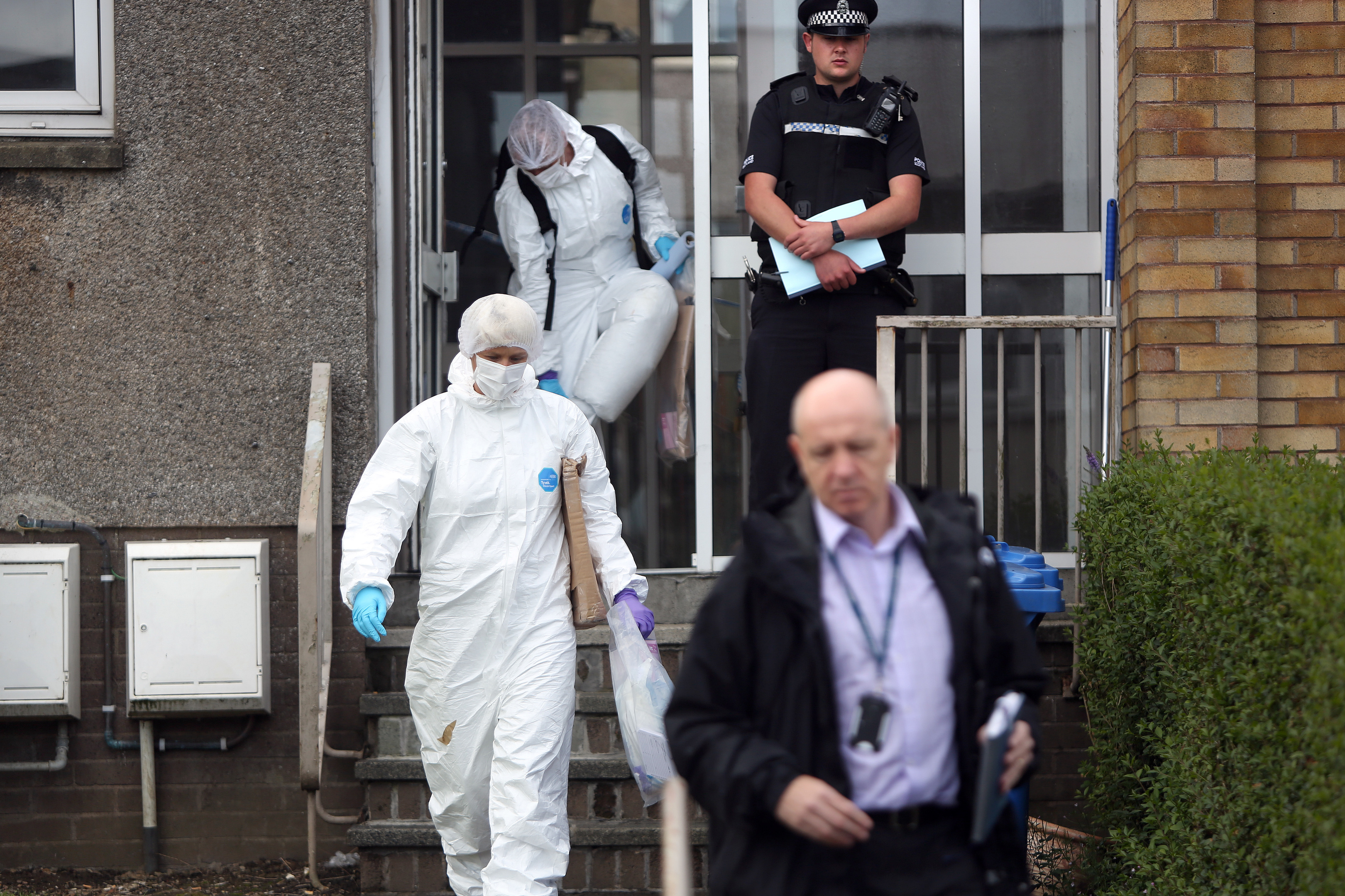 Forensics officers have been examining the flat.