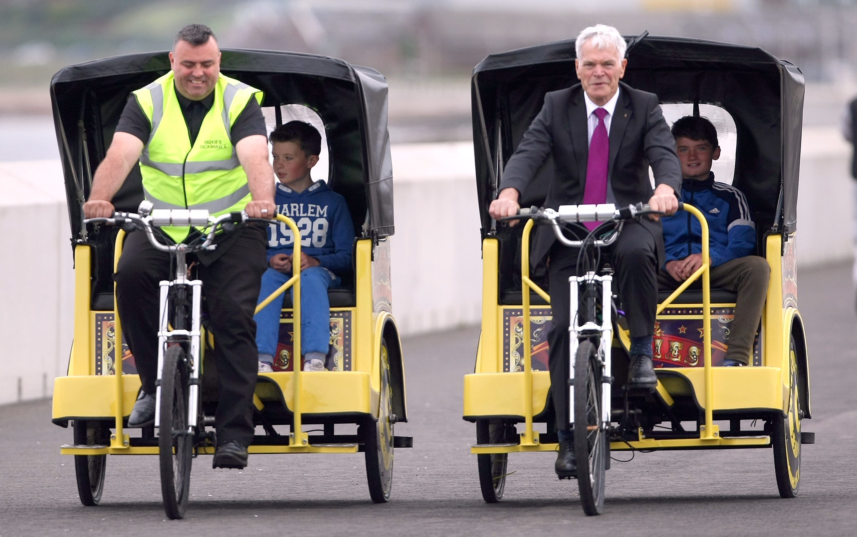 Tyrone Reekie cycling his rickshaw with Councillor Rod Cavanagh.