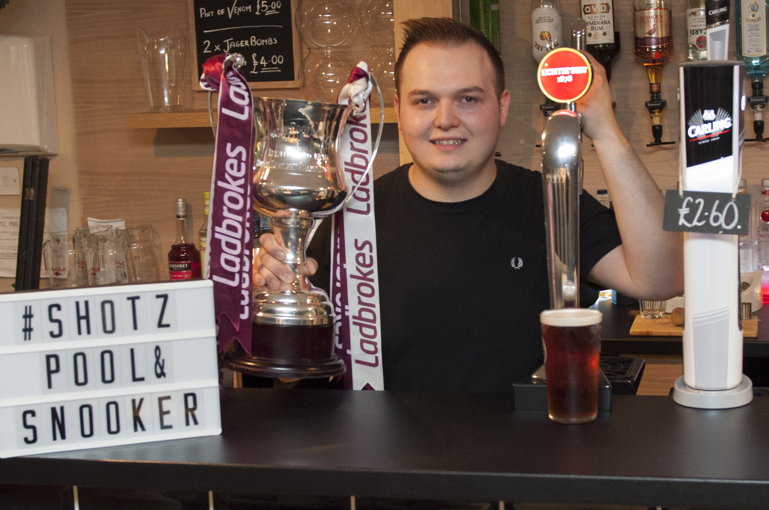 Ryan Fleming with the title trophy and the Lichtie Best Ale.