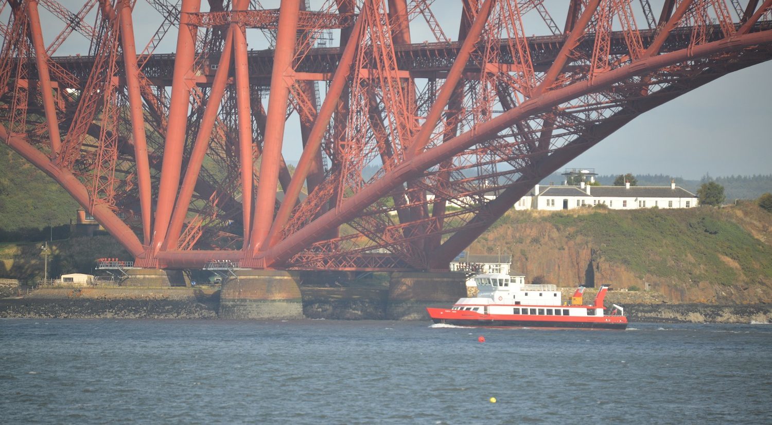 The Forth Hope sails under the Forth Bridge