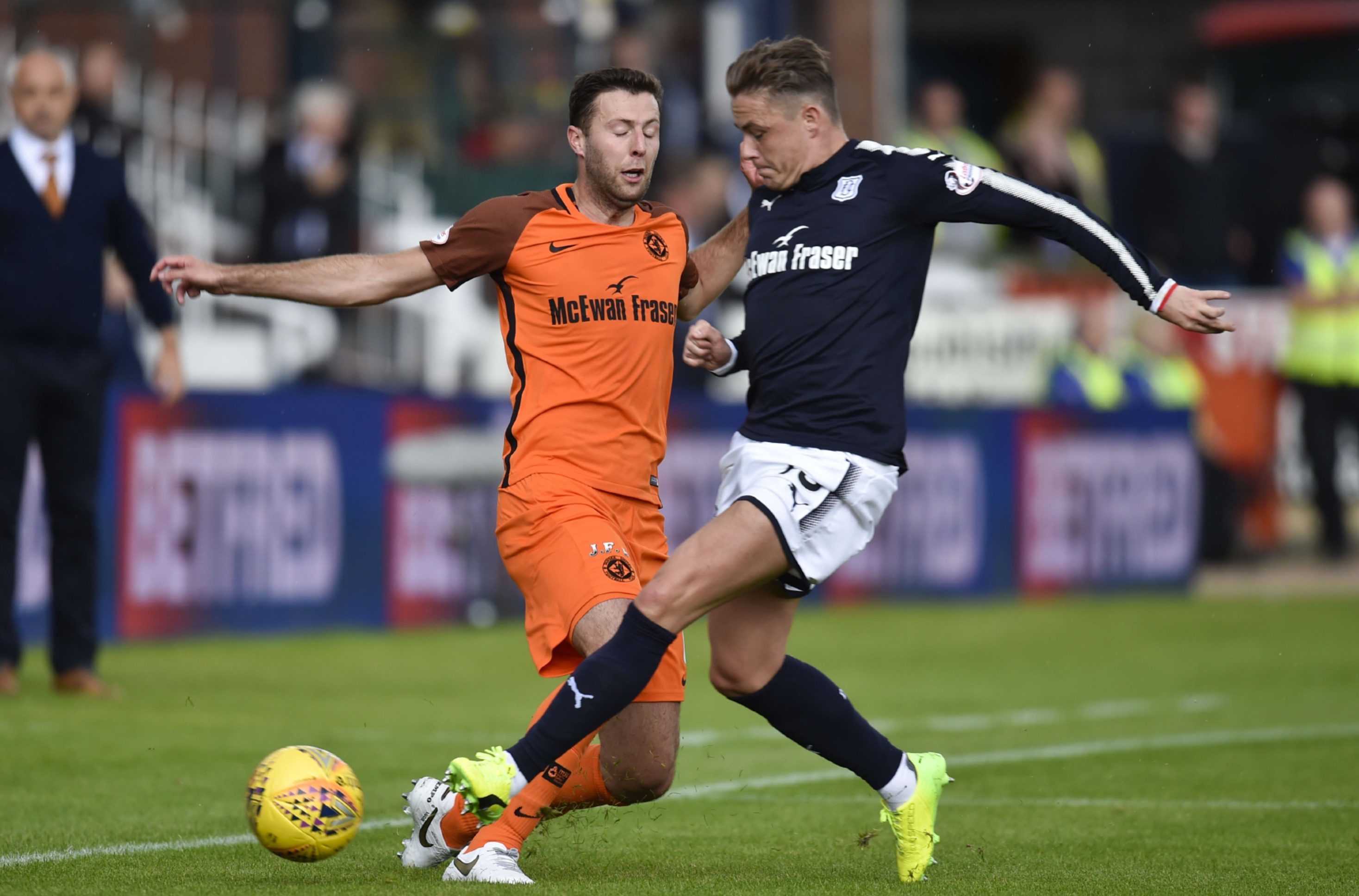 Dundee's Scott Allan challenges Lewis Toshney during the derby.