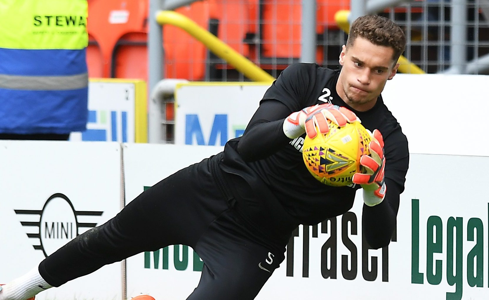 Harry Lewis in action for United.