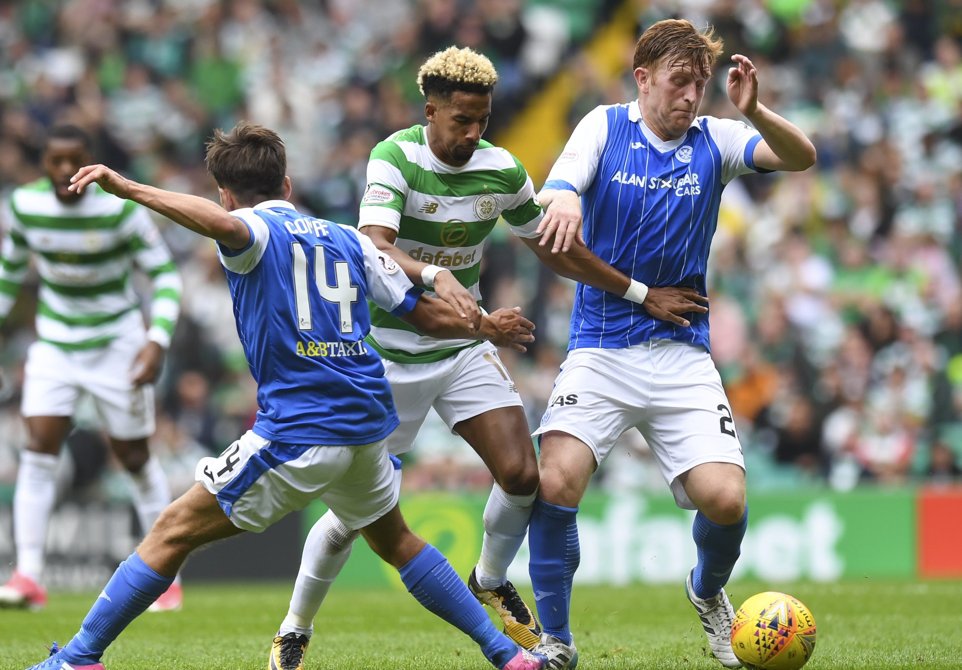 Celtic's Scott Sinclair is tackled by Aaron Comrie (left) and Liam Craig