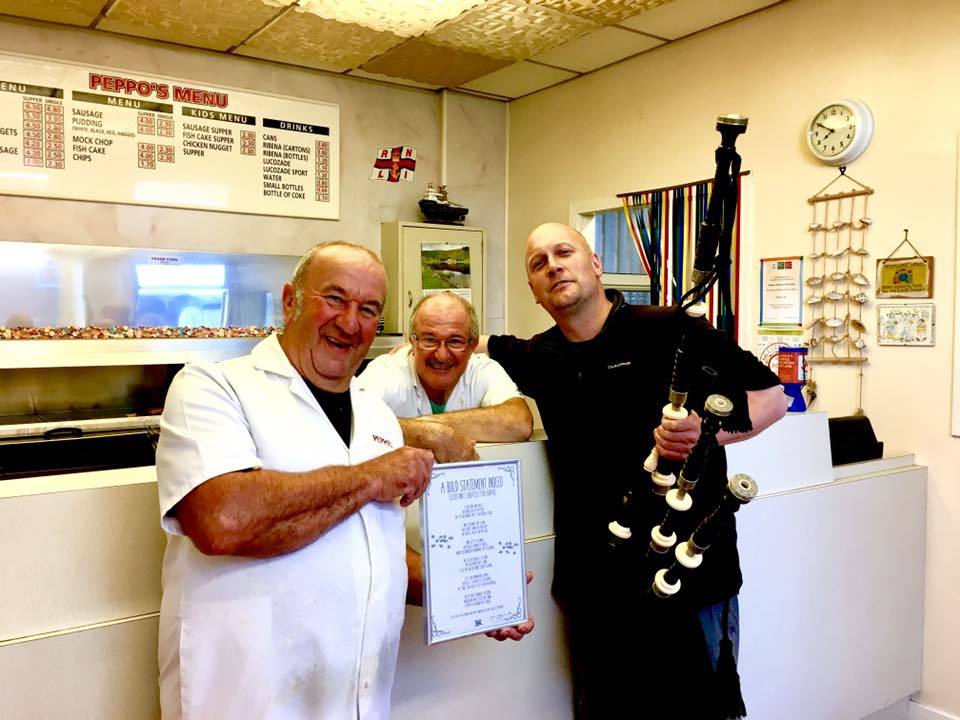 Peppo's owners Johnny and Frank Orsi with Johnny Gauld who wrote a poem honouring the Arbroath shop's fish supper.