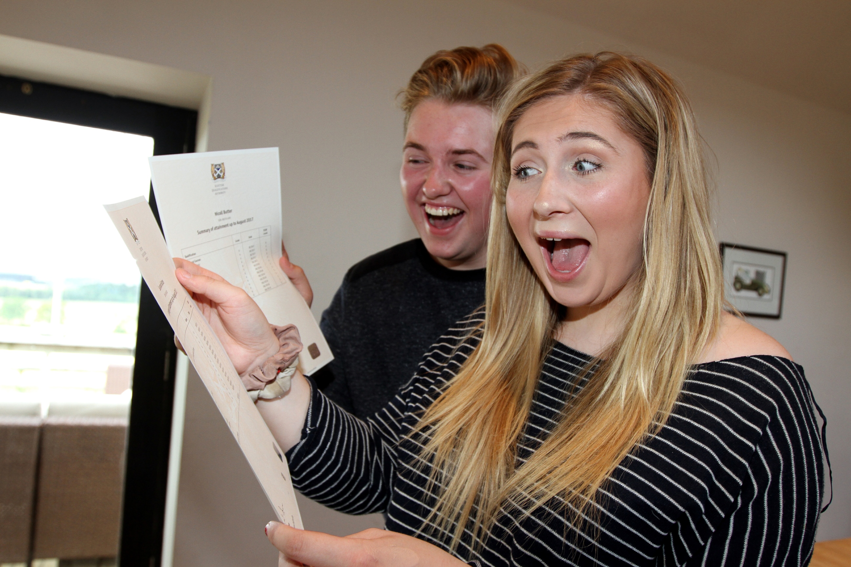 Nicoll and Susie Butter opening their exam results at home on Tuesday.