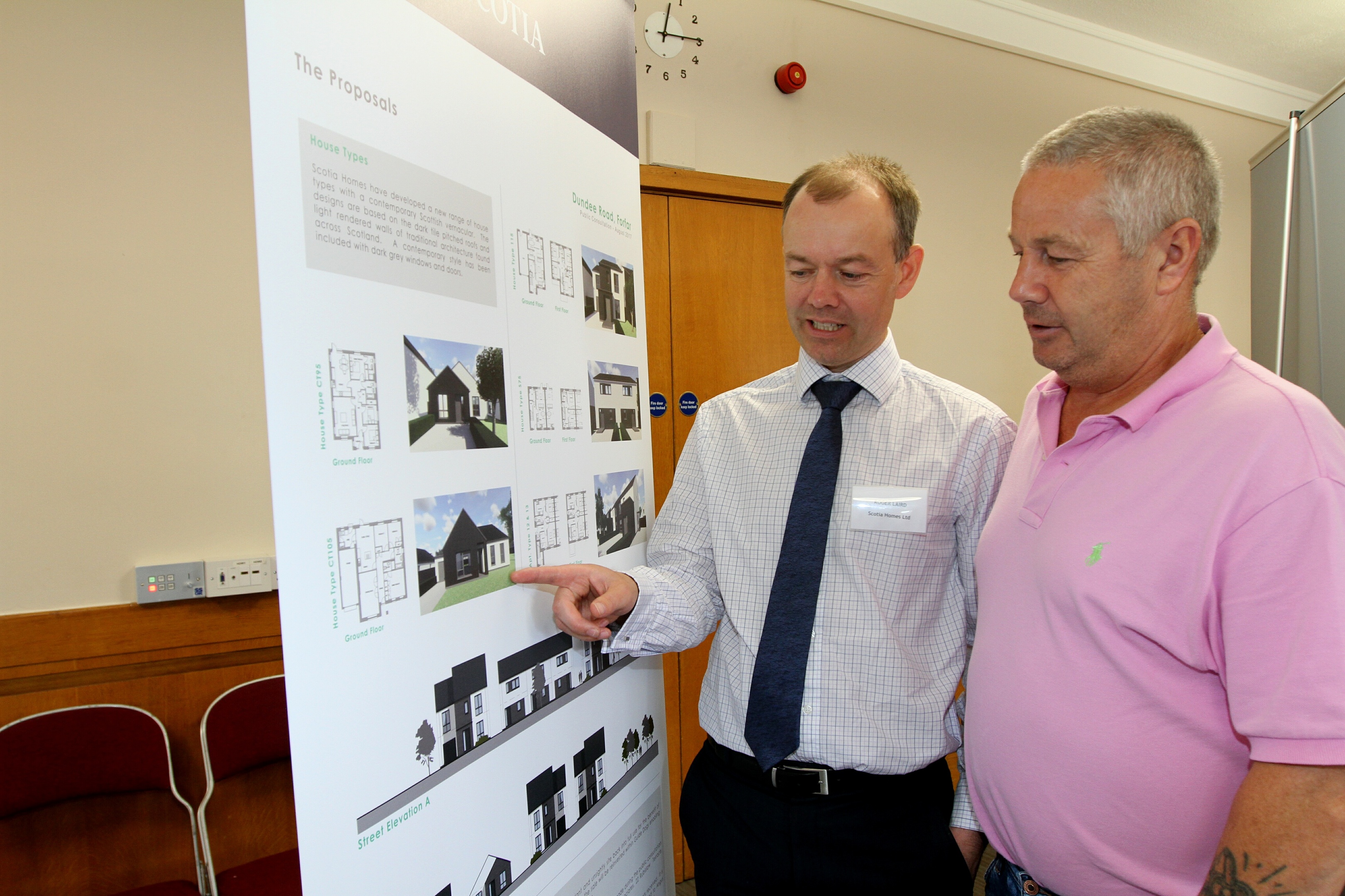 Roger Laird of Scotia Homes with local resident David Taylor