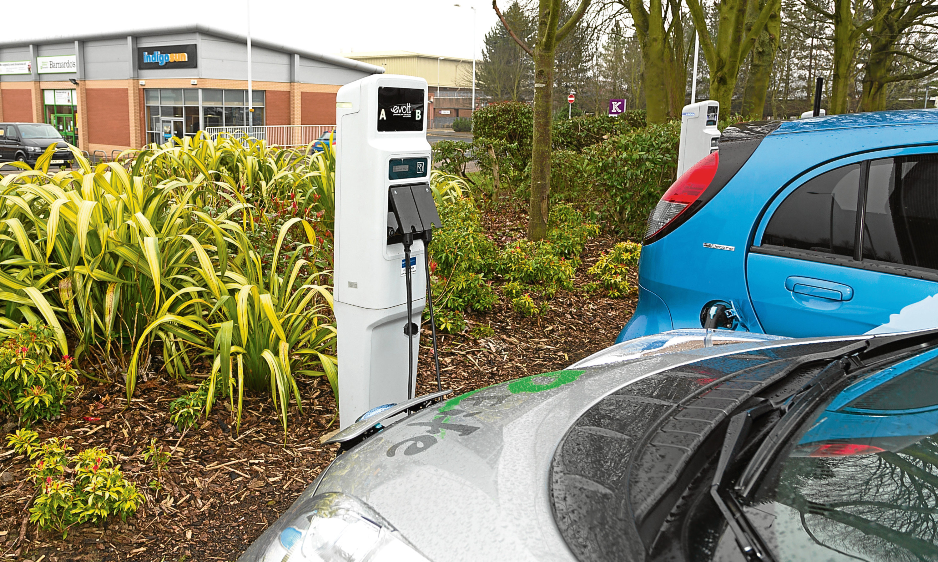 Electric cars at a recharging point in Fife.