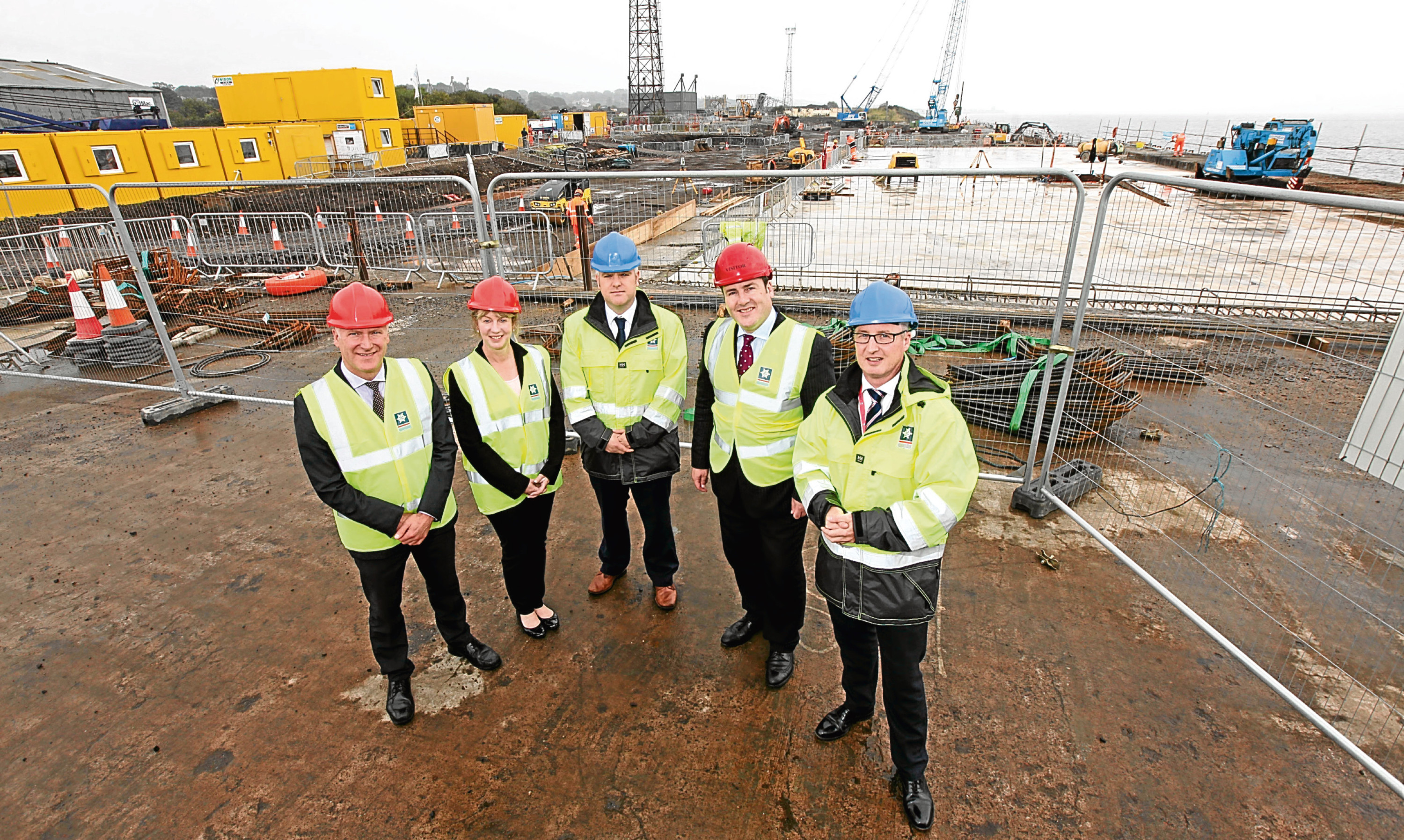 Joe Fitzpatrick MSP, Shona Robison MSP, Dundee Port Manager David Webster, Energy Minister Paul Wheelhouse and Forth Ports COO Stuart Wallace at the docks redevelopment site.