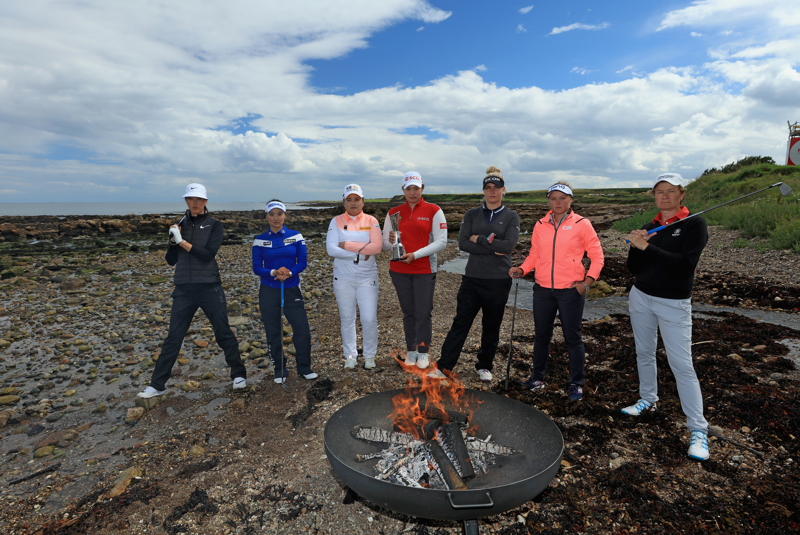 Michelle Wie, So Yeon Ryu, Inbee Park, Ariya Jutanugarn, Charley Hull, Brooke Henderson, and Catriona Matthew at the official photocall for the Ricoh Women's British Open at Kingsbarns.