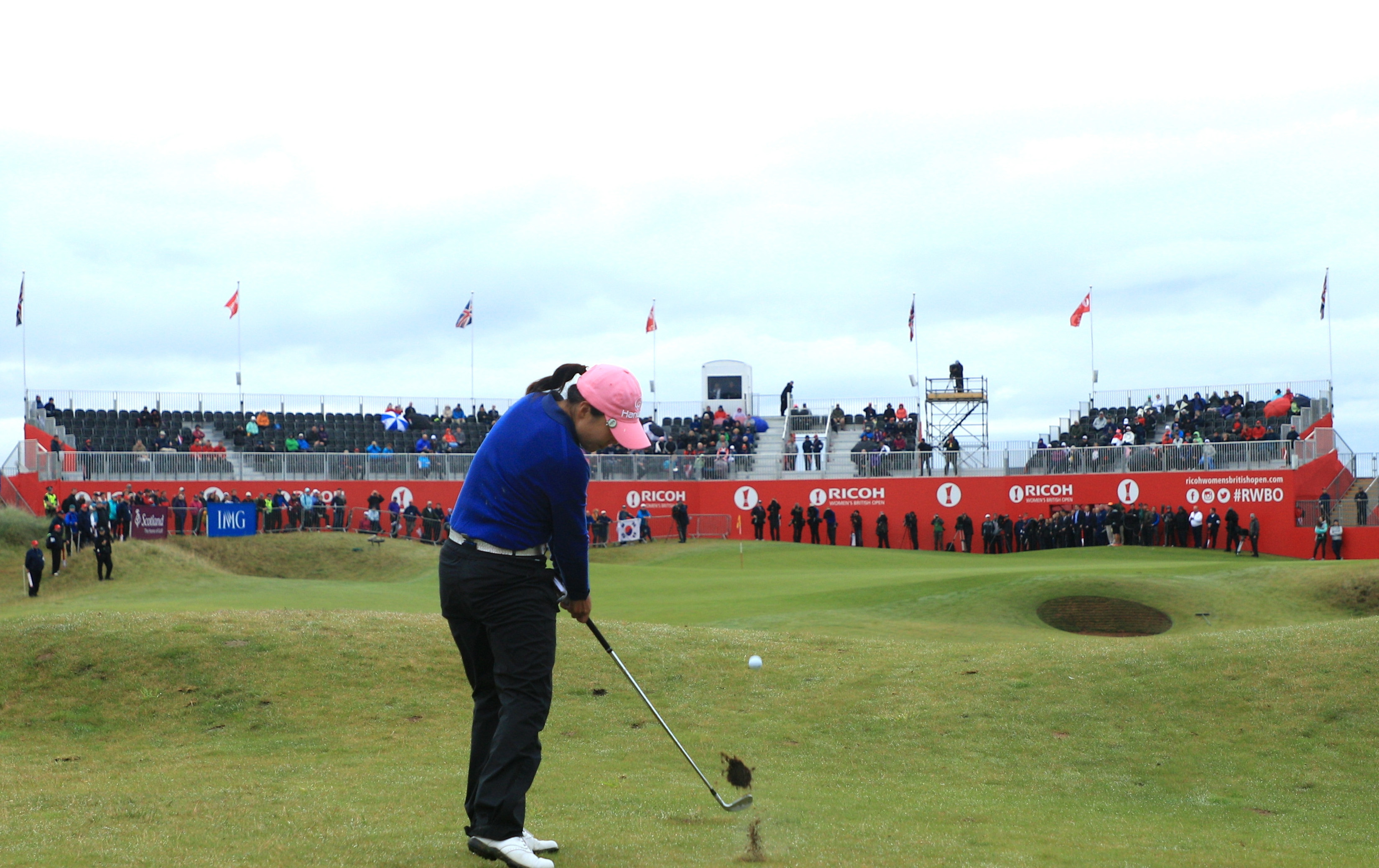 In-Kyung Kim hits her second shot into the 18th green on her way to victory in the Ricoh Women's British Open.